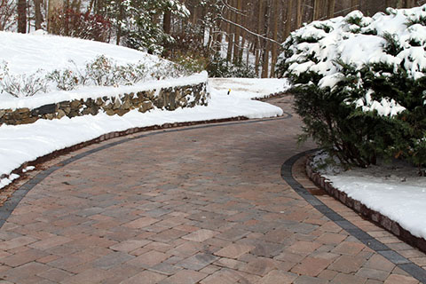 Heated paver driveway and parking area.